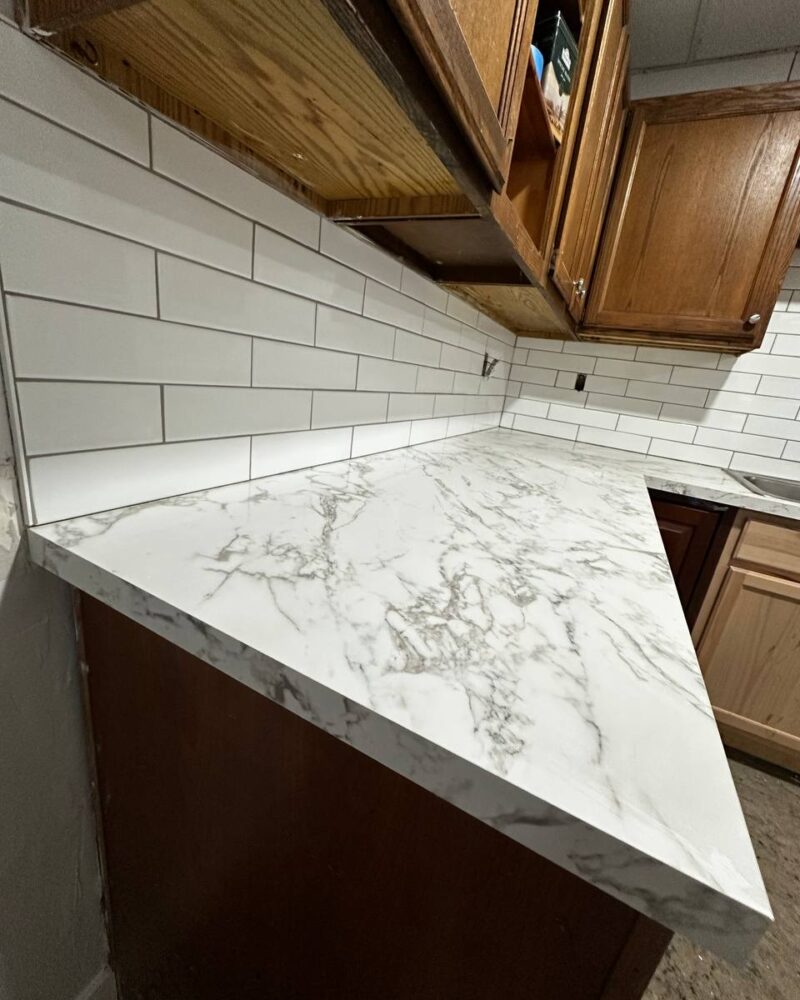 Marble countertop corner with subway tile