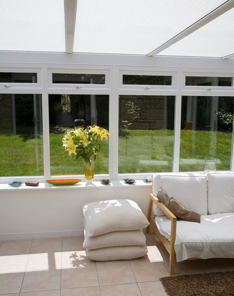 Bright sunroom with new tile floor