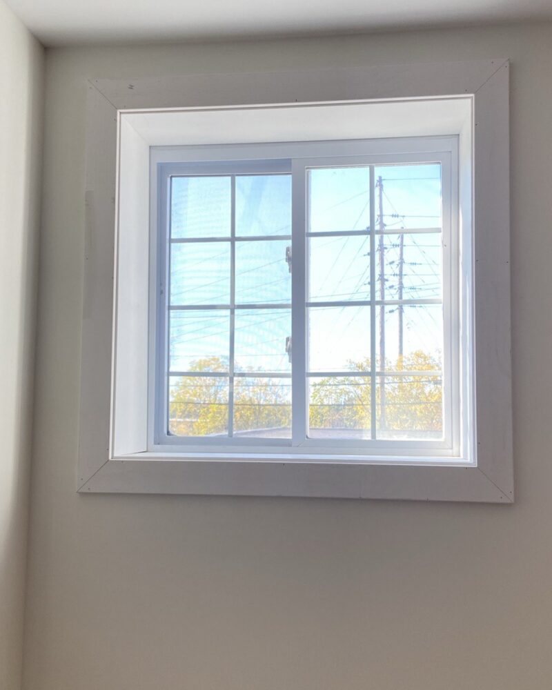 New window with fresh drywall and trim