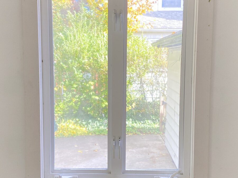 Replacement window installed with new trim